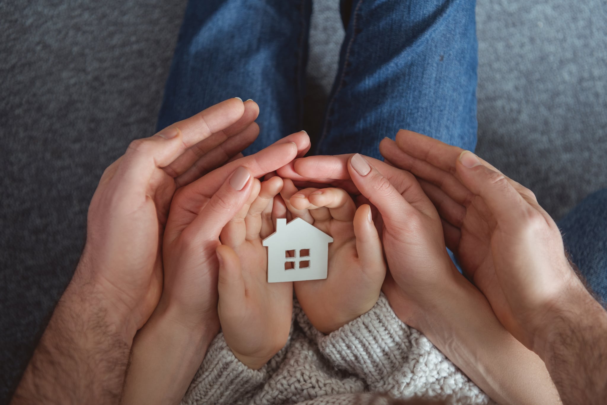 Family hands together at home